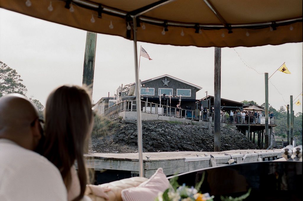 Arriving at The Wyld Dock Bar by Joyride, the restaurant and its flag ahead