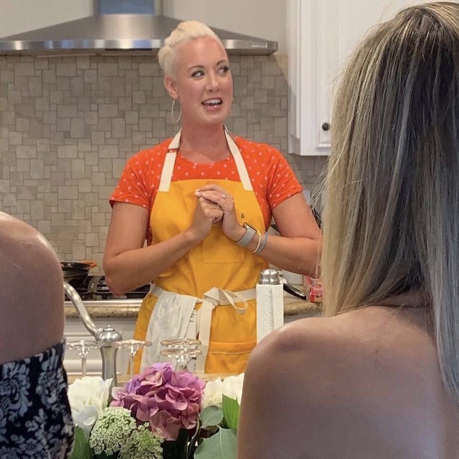 Audra in a yellow apron teaching a MaxLove Project culinary medicine class